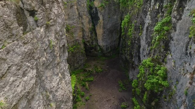 Aerial view of Maltas Canyon, Dagestan, showcasing a vast valley with steep mountain walls, resembling locations used in Hollywood movie scenes.