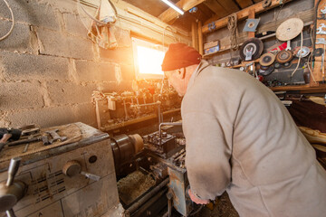 Elderly Craftsman Working in a Rustic Workshop