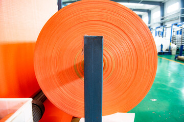 The weaving workshop machinery of a certain packaging factory is running, producing new fiber ropes and fiber bags