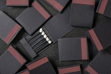 top view paper packages black match sticks at horizontal composition