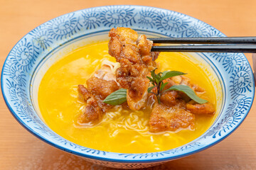 angle view sour soup noodles with chicken at horizontal composition
