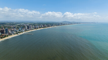 Panoramic view of the vast coastline of Balneário Piçarras, one of the fastest-growing beaches in Brazil, highlighting the expansive beach and the Atlantic Ocean.