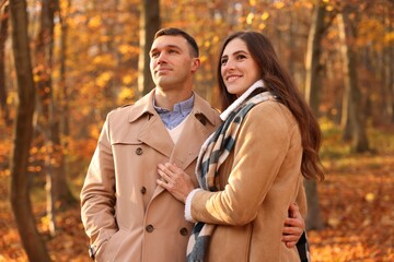 Fototapeta premium Happy couple spending time together in autumn park