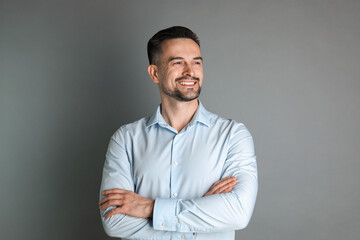 Obraz premium Portrait of handsome middle aged man on grey background