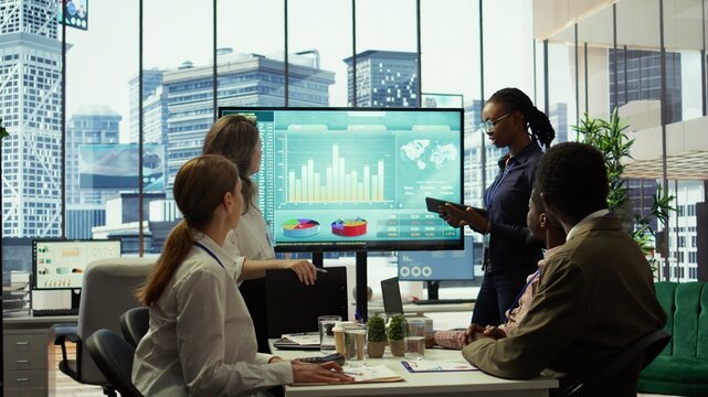 PR team presenting infographics and digital marketing insights for growth, showcasing the impact of recent campaigns and outlining plans for future development initiatives in workspace. Camera B. - Powered by Adobe