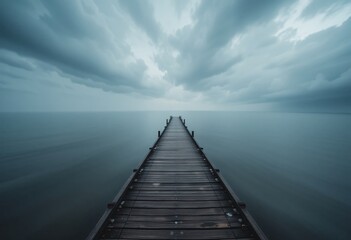 Fototapeta premium Serene Lake View. Wooden Pier Stretching Into Mist. Moody Clouds Gather Above. The Horizon Beckons With Diffused Light And Tranquil Water. Nature's Beauty Captured.