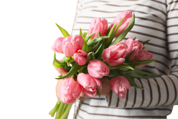 8 March, International Women's Day, woman in a striped sweater with a bouquet of pink tulips in her hands, isolated on white background, PNG