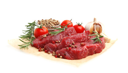 Pieces of raw beef meat, spices and tomatoes isolated on white