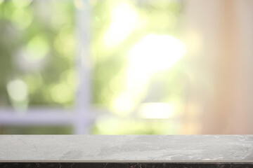 Fototapeta premium Empty grey marble table in room. Space for design