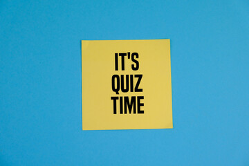 the words Quiz Time beside mini alarm clock on a plain background. the concept of answering quizzes or quiz games. text space