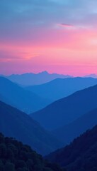 Fototapeta premium Layered blue mountains meet the horizon under a gradient sky at dusk, mountains,
