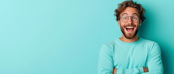 Fototapeta premium Happy Young Man with Glasses Smiling Against a Bright Background