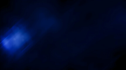 Fototapeta premium Dark background with a faint blue light flare in the lower left, creating a subtle, mysterious, and slightly luminous effect.