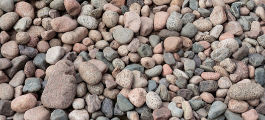 Variety of Smooth and Textured Stones Arranged in Natural Earthy Tones