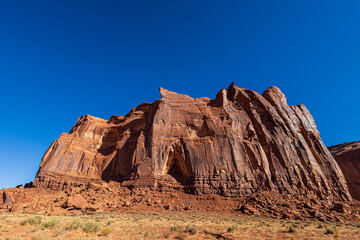 Fototapeta premium Beautiful Monument Valley seen from Monument Valley Scenic Drive. The drive is a 17-mile loop on a rough dirt road in the valley.