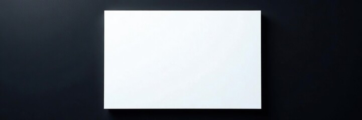 White paper on black wall with subtle texture, neutral, clean