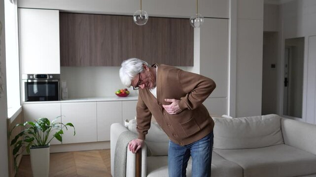 Heart attack and fainting. Lonely anxious man clutching heart collapsing at home, losing consciousness. Chest pain, cardiac arrest, emotional turmoil, physical shock, alarming chronic illness