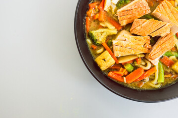 green curry vegetable noodles with pan-fried tofu, healthy  Asian food