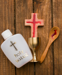 bottle with holy water and cross. Concept of the hundred jesus