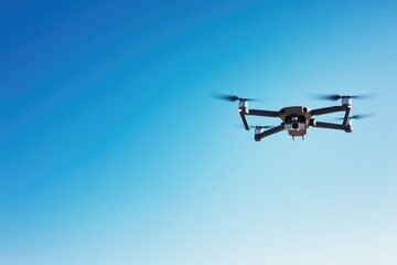 Fototapeta premium sleek drone hovers in clear blue sky capturing essence of modern aerial technology offering vast amounts of copy space
