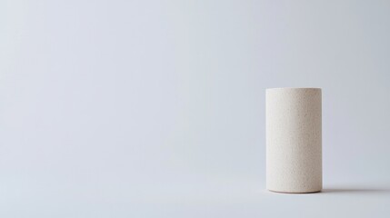 capture single eco-friendly packaging item thoughtfully placed against clean white background creating serene minimalist