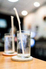 Refreshing ice with water served in clear glass cups on a dinner table, drinking water at dinner meal time at the restaurant