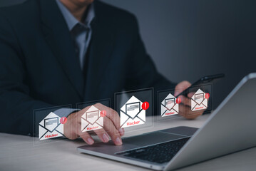 Fototapeta premium businessman receiving multiple phishing emails marked as hacker threats laptop and smartphone. cybersecurity concept email scams, online fraud, and digital security risks and data protection.