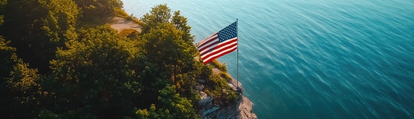 An American flag is flying on the cliff overlooking Lake Michigan, an aerial view captured by a drone.