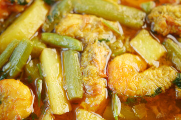 Fresh shrimp and vegetable stew cooked with spices in a vibrant dish