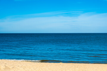 Nature of the beach and sea Summer with sunshine, sandy beaches, clear blue waters sparkling against the blue sky. On an island with good ecology and environment Background for summer vacation