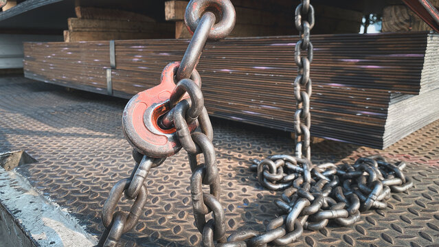 hook , chain and steel wire,Steel chain and hook securing anchor, using to secure heavy object that transported on the trailer truck. Industrial safety equipment, close-up at the object.