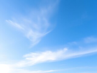 Fototapeta premium Serene azure canvas, wisps of cirrus gently dance, ethereal sky