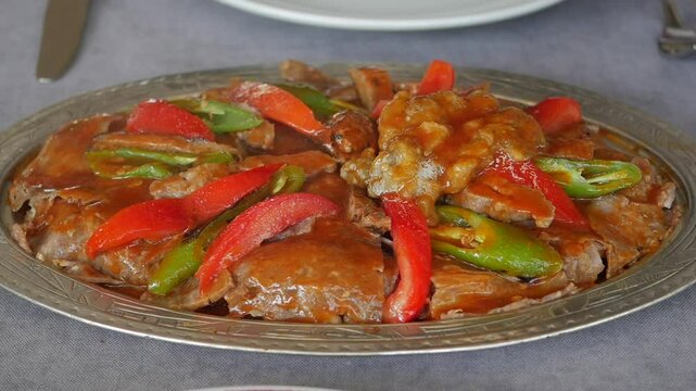 iskender Doner Kebab with butter, tomato sauce and yoghurt, Turkish Traditional meal