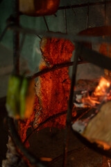 punta de espalda a la llama