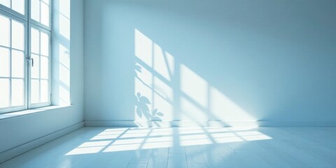 Fototapeta premium Serene Sunlight Illuminating an Empty Room with White Walls and a Large Window, Casting Gentle Shadows on the Floor and Walls