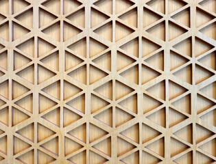 Close up of geometrical hexagon shape pattern carved from plywood. 3D cutout laser cut hexagonal...