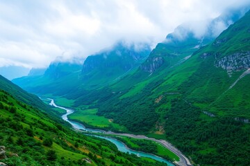 Obraz premium Serene Green Valley with River and Majestic Mountain Backdrop