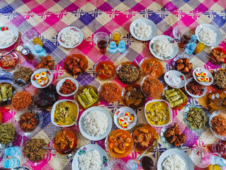 Indonesian Cuisine Feast: A Vibrant Display of Traditional Dishes and Drinks on Woven Mat