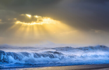 Heavy waves on the ocean during sunset