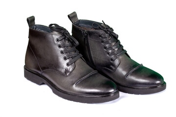 Classic black mens winter boots on a white background