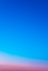 Clear Sky sunset nature background. Stunning view of lpink and blue sky