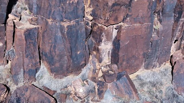 Aerial Virgin River canyon black volcanic rock Utah slide. Southwestern desert Utah. Land of Shivwits Band Paiutes, Native American Indians. Geological erosion. Red sandstone black volcanic canyon.