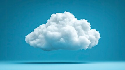 Single Fluffy Cumulus Cloud Isolated on a Blue Background