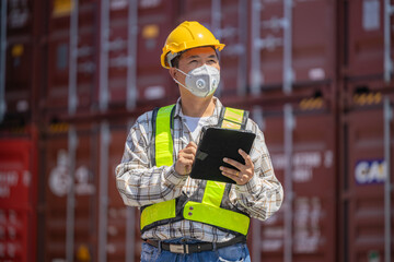 Foreman or worker work at Container cargo site check up goods in container. Foreman or worker checking on shipping containers. Logistics and shipping.