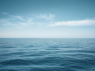 Obraz premium Tranquil Seascape with Gentle Waves and Clear Blue Sky Above, Perfect for Illustrating Serenity and Nature's Beauty in Stock Photography