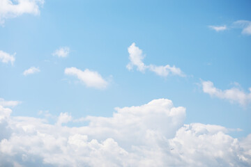 Bright Blue Sky with Fluffy White Clouds on a Sunny Day