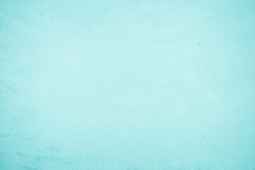 Pastel blue and white concrete stone texture for background in summer wallpaper. Cement and sand wall of tone vintage. Concrete abstract wall of light cyan color, cement texture mint green for design.