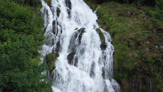 River of Life: 4K Drone View of a Cascading Stream Cutting Through Rocks