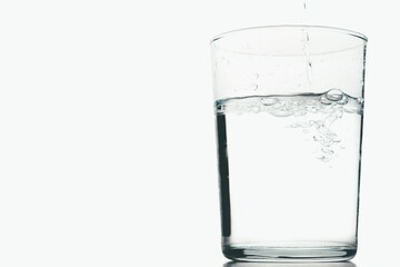 glass of crystal clear water in motion