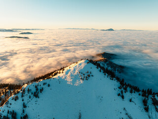 Naklejka premium Winter hiking to Sina in Low Tatras National park near jasna is full of beautiful views. Sunset in Slovakia mountains with Chopok peak.